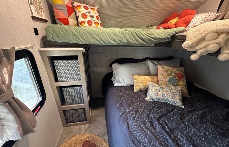 The queen bed can be setup as a couch and the bunk beds can be up or down as photographed.