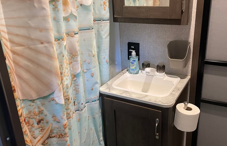 Bathroom area with shower.