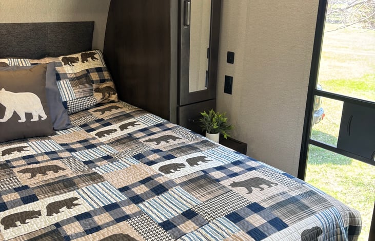 Cozy front bedroom with queen size bed, plenty of storage above, to the side and under the bed. You have your own entrance. This room also has USB & 120 outlets on both sides of the bed.