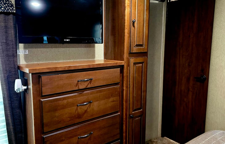 TV and dresser in master bedroom