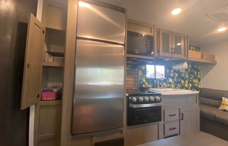 Kitchen with three burner stove with oven.