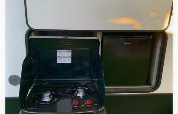 Enjoy outdoor entertaining with this outdoor grill and refrigerator.  While entertaining, you can listen to the stereo or hook up an outdoor tv.  All in the shade provided by the huge canopy!