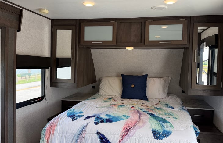 Spacious bedroom layout with dual windows for natural light and easy access from both sides.