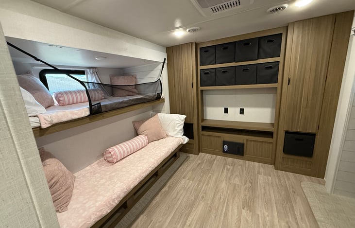 2 bunks and rear entertainment center and storage