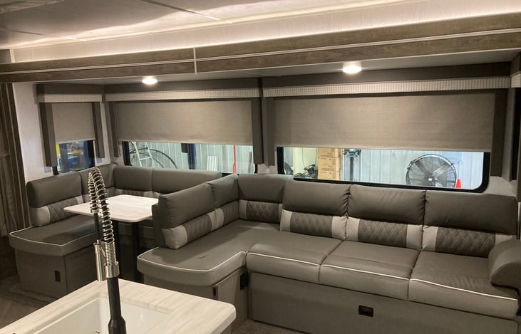 sofa and kitchen table area convert to two beds