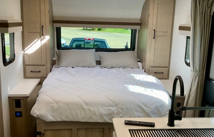 Queen murphy bed with full storage for clothes on both sides. Large 1 way window (See out only) with pull down shade.