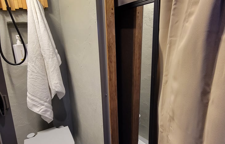 Included low-profile mirror, front and rear curtains for privacy.