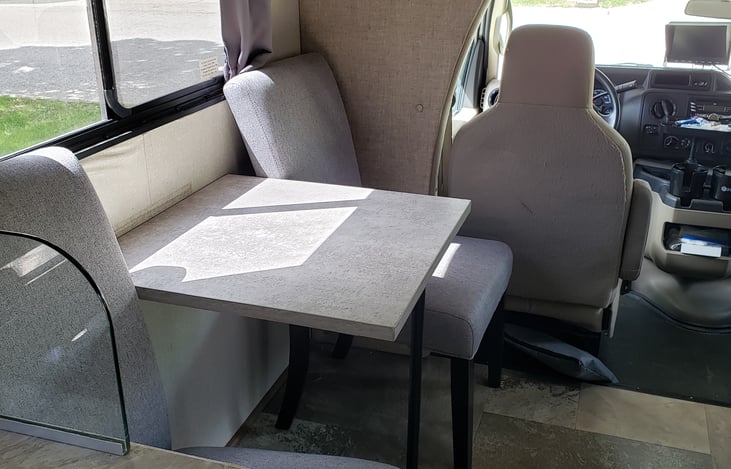 Small dinette and 2 comfortable chairs.