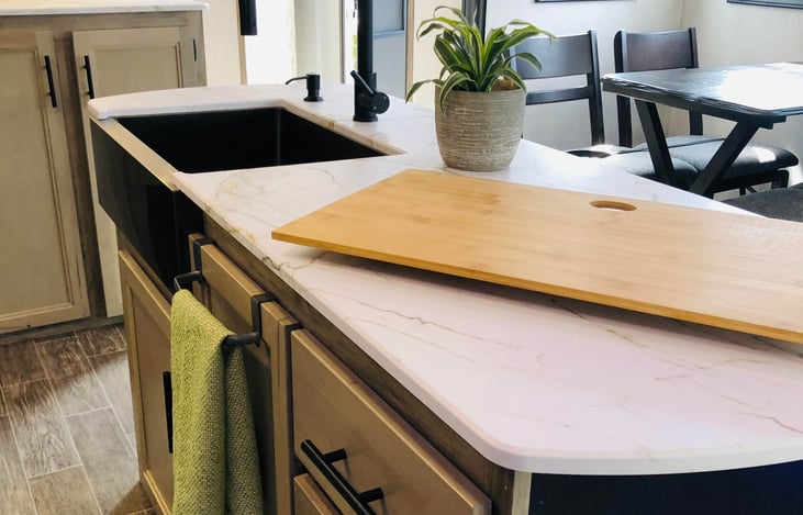 Large kitchen island with farmhouse sink