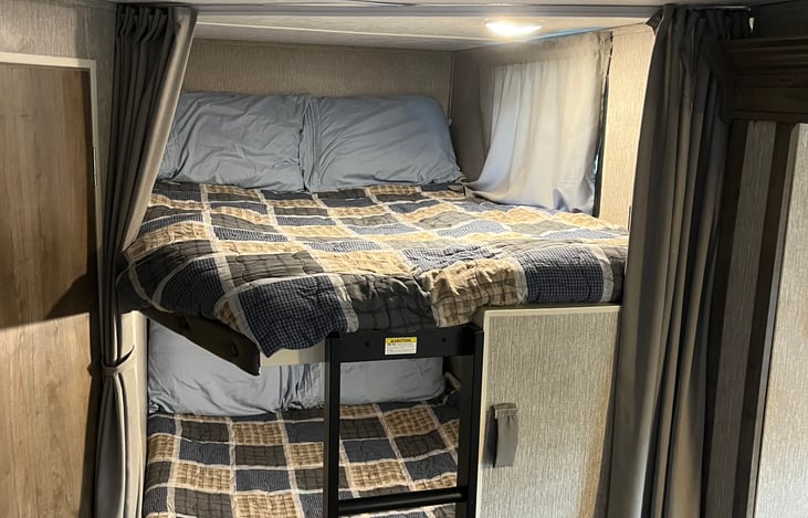 Bunk beds. These beds are the size of a short full mattress. Each bed has a 300 lb max weight. An ideal spot for children.