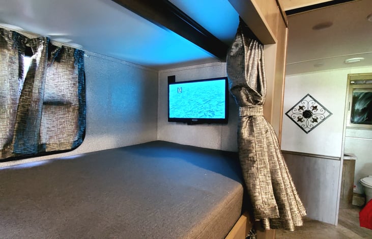 Each bunk bed has its own TV and USB station.