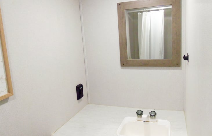 Sink and a mirror that will tell you you're the prettiest of them all if you ask it.