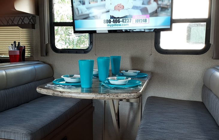Dinette also makes a bed. Dishes and cookware are included.