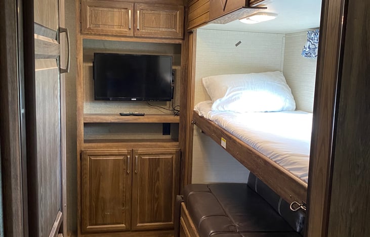 Bunkhouse right side: two beds, left side (not pictured) 1 bed with plenty of head space and TV.