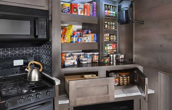 hidden pantry behind TV, will be stocked with basic seasonings