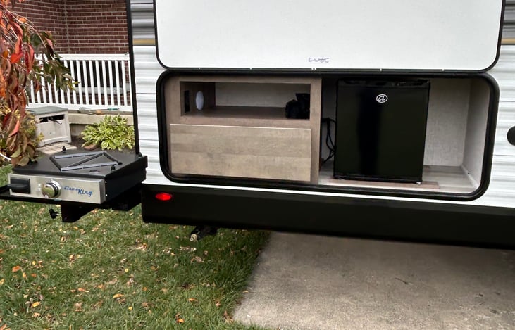 Out door kitchen mini fridge and gas griddle/black stone.