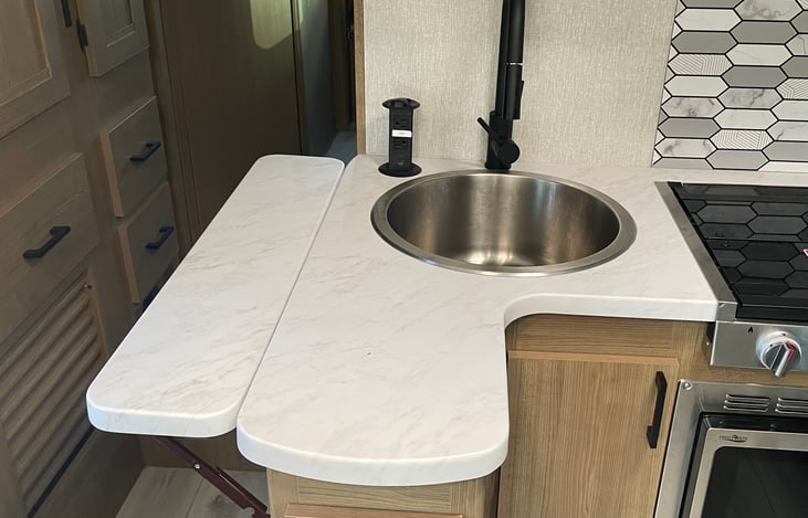 Extended countertops and deep sink.