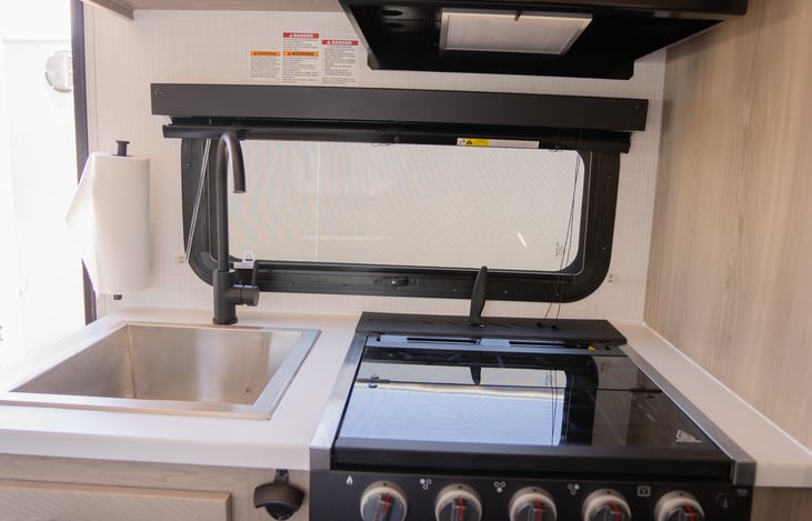 Kitchen sink, gas oven and 3 burner stovetop
