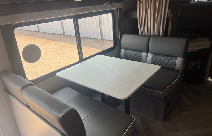 Dinning table that can drop down to make a bed if needed.