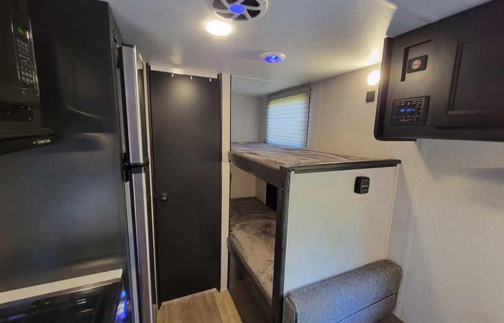 Bunk bed, lower bed folds up for additional storage