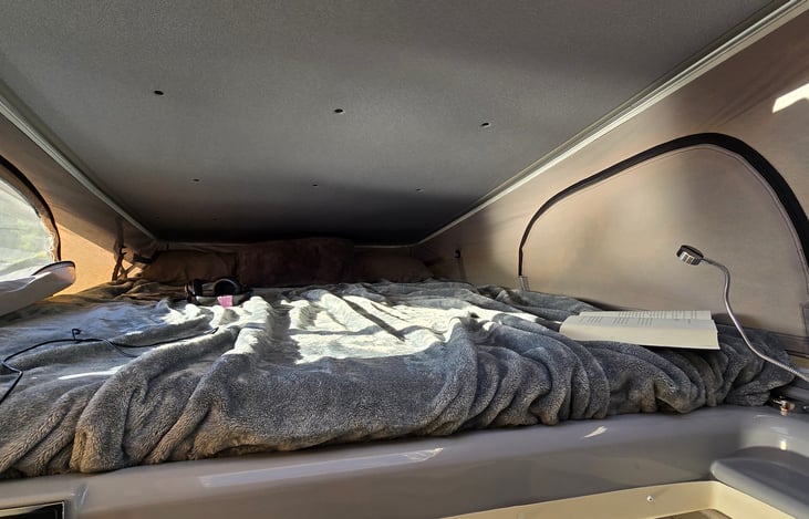 Enjoy a good book in the private bunk area, with lights and USB power.