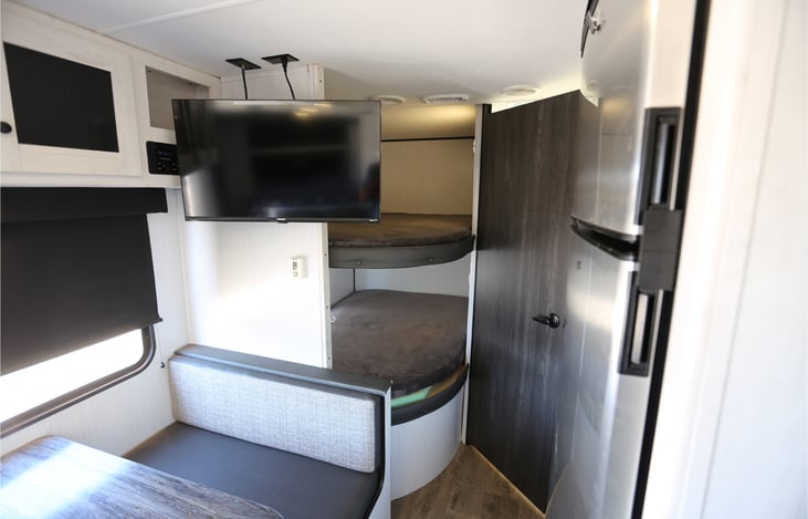 bunks, TV and refrigerator