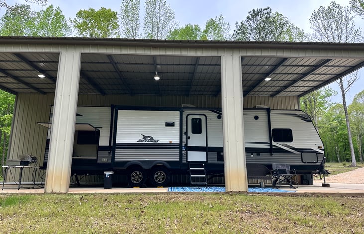 RV protected from the elements when on our property