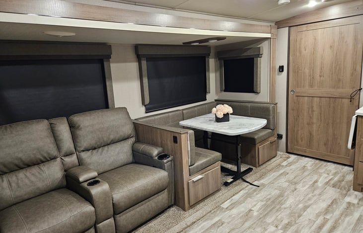 The bench at the dinette table can be used under the window for seating or moved to the end of the table in the kitchen floor space for more room.