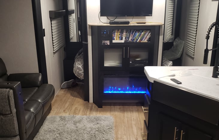 Either enjoy the glow of the fireplace  or actually use it for warmth. DVD and some movies along with 32 inch flat screen.