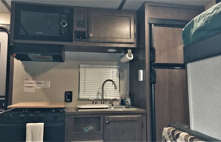 3 burner gas stove, oven, microwave, and double sink make this a great place to cook anything.