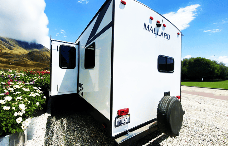 Rear shot of the Marshmallow trailer, perfect for booking to Johnson Valley or Ocotillo Wells. This travel trailer is towable and fits right in at both mountain and coastal parks like Dana Point.