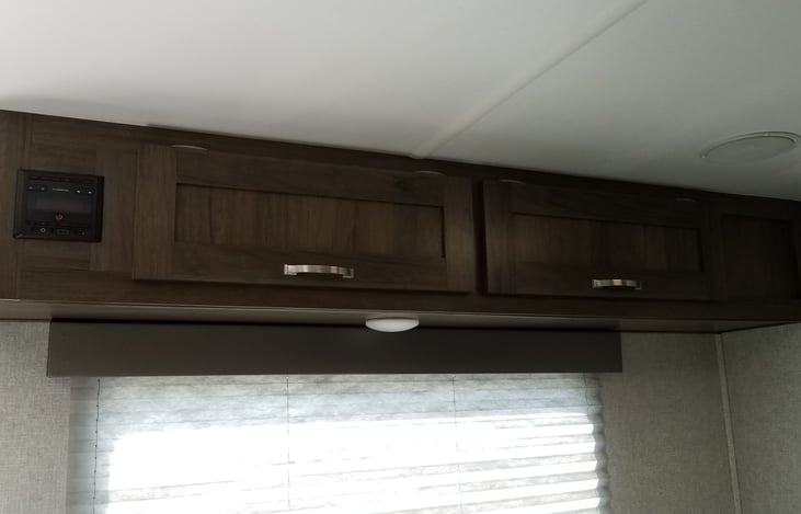 Storage and Bluetooth stereo controls above dinette