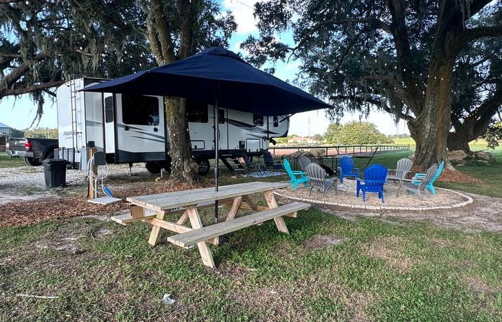 Fire pit, full size grill, hammock, picnic table and lounge chairs included at stationary site.