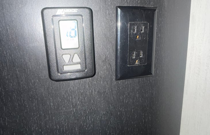 AC and heat control panel, located by bunkbed ladder