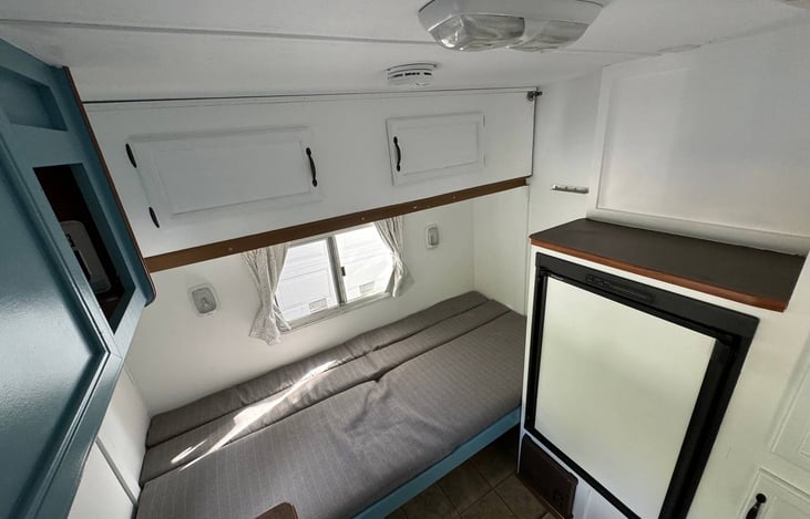 Couch at the back transformed into bed