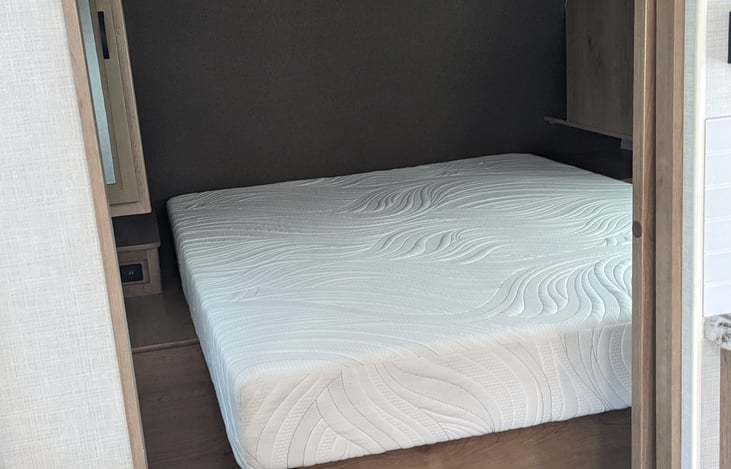 Bedroom with short queen bed