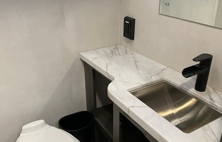 Bathroom/ water closet! This area has lots of cupboard space.