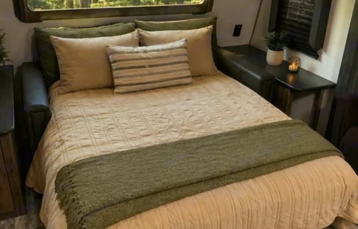 The front also includes a trifold sofa that can convert into a queen-sized bed for guests.