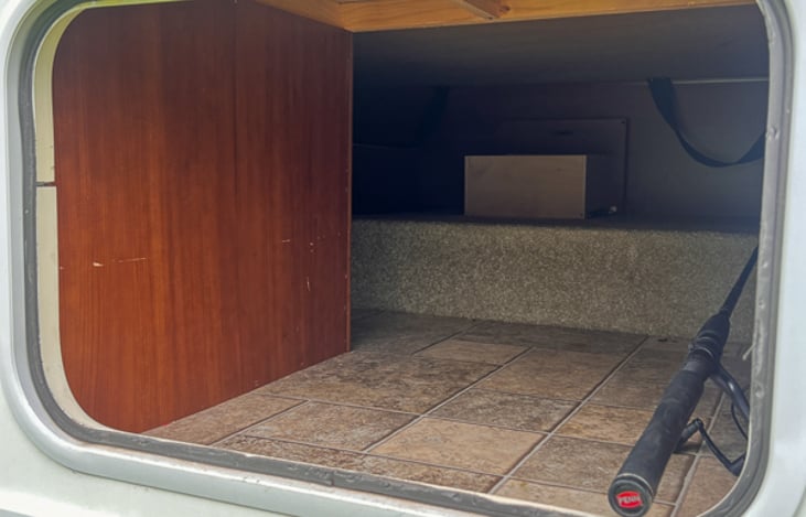 Rear outside storage bay under the queen bed.  Stow longer items back here.  Can be locked for security when away from RV.