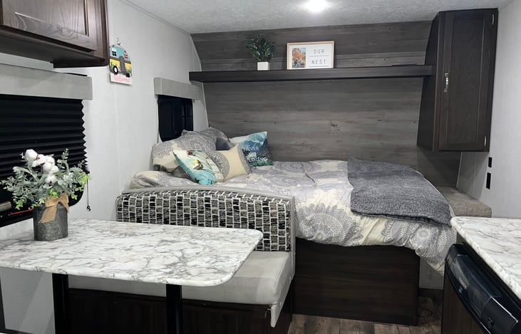 Master bed (queen) + dinette which converts to a 2 person bed. Closet next to bed.