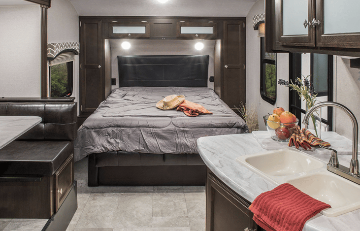 Queen bed, bedside phone chargers, privacy curtain.