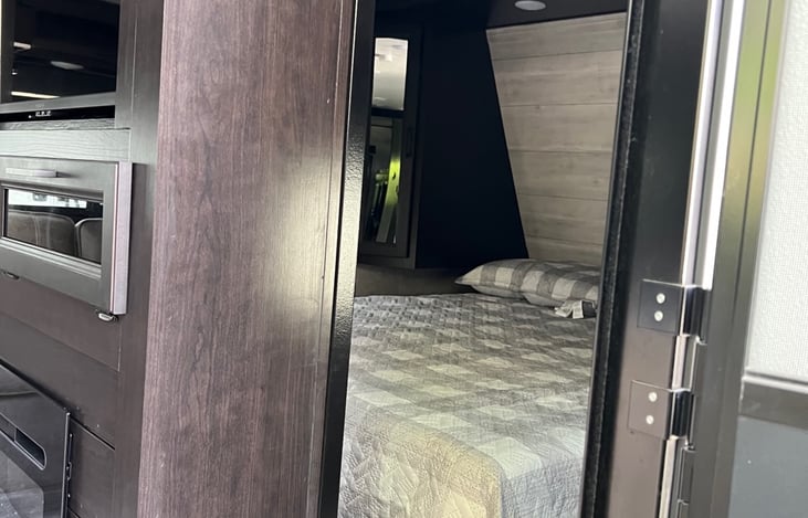 Entrance way into RV. View of Bedroom.