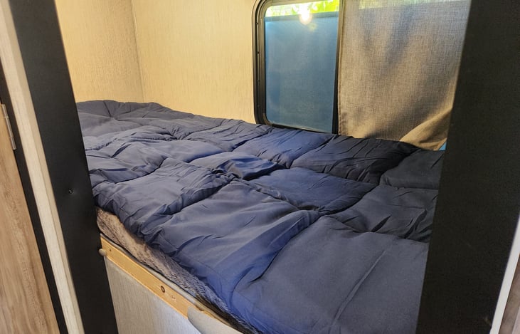 Soft bunk bed mattress topper included in rental