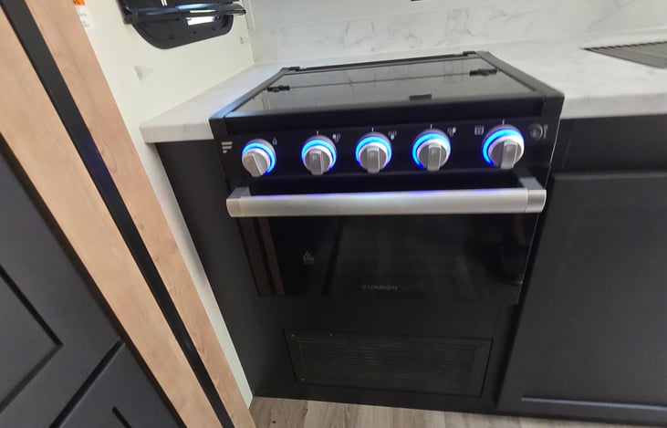 Stove with light up knobs