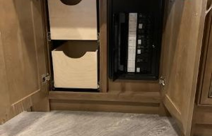 More bedroom storage with main circuit breaker panel.