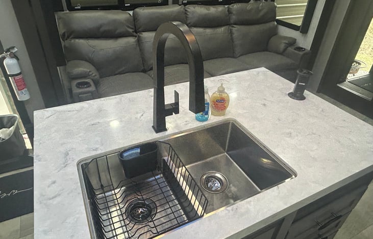 Full size sink with pull down sprayer nozzle.