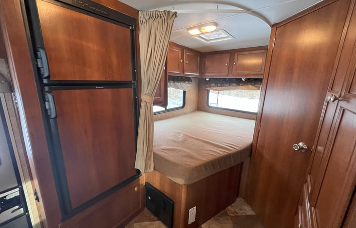 View of bedroom with bathroom door shut.