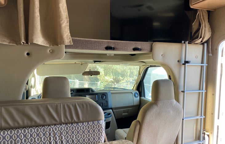 Large television can be turned to view from the table area.