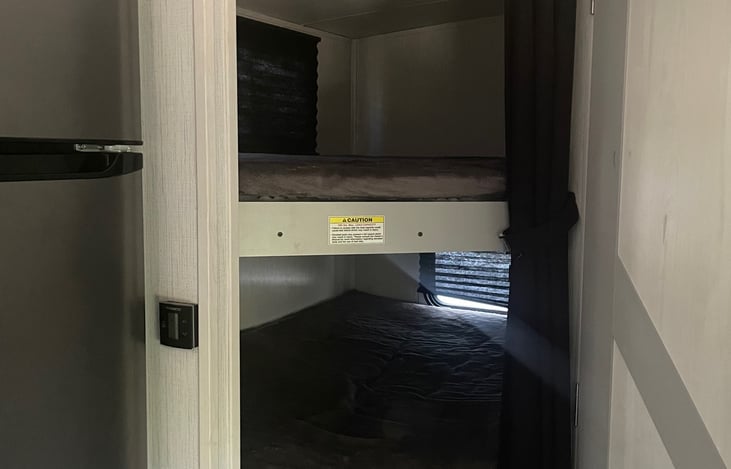 Double Full size bunk beds both with a window and extra padding under the mattresses.