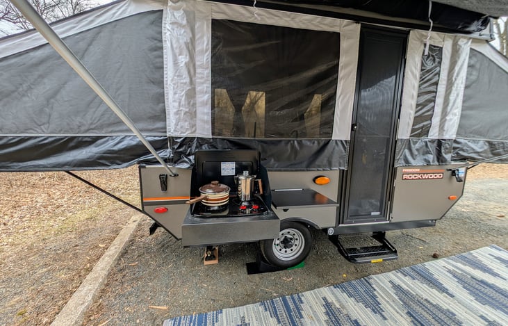 Outside burner with side table. Coffee pot and cooking pot included. However, to include the outside burner, please see add-ons.